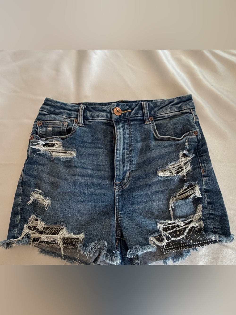 AEO Blue Distressed High-Rise Denim Shorts with navy patch pockets stretch
